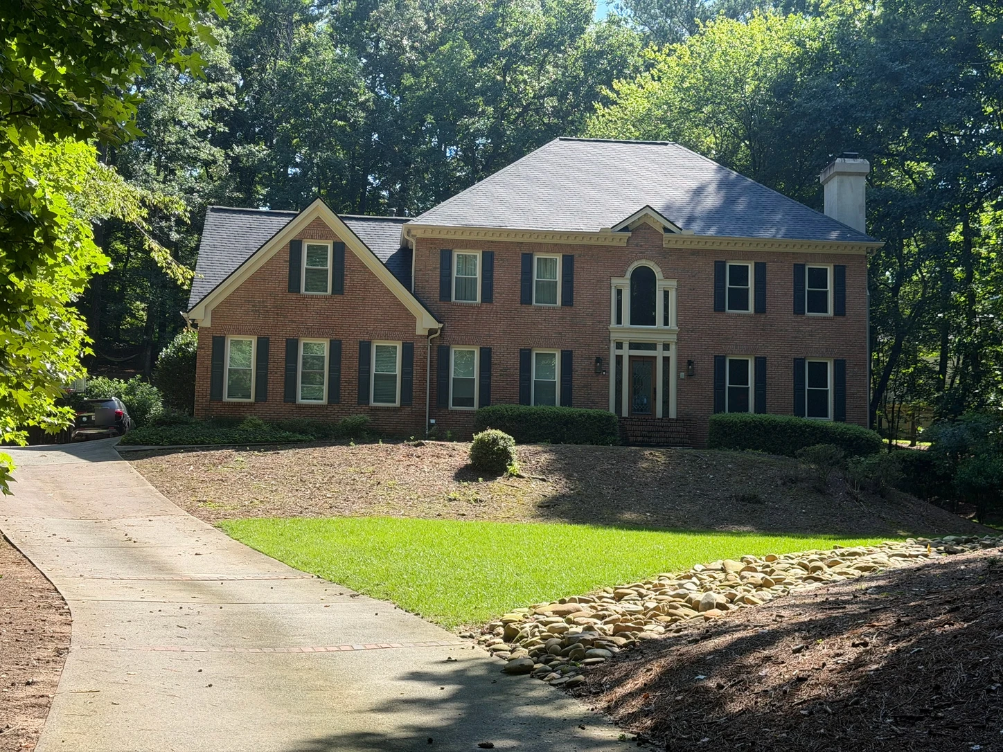 A large front yard before a landscaping concept